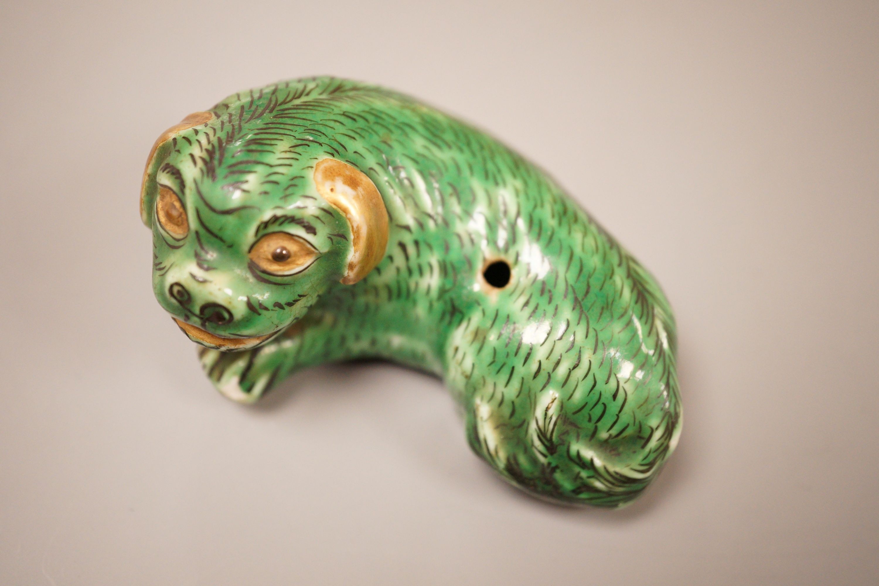 A small Chinese or Japanese green glazed dog waterdropper, 8.5cm wide